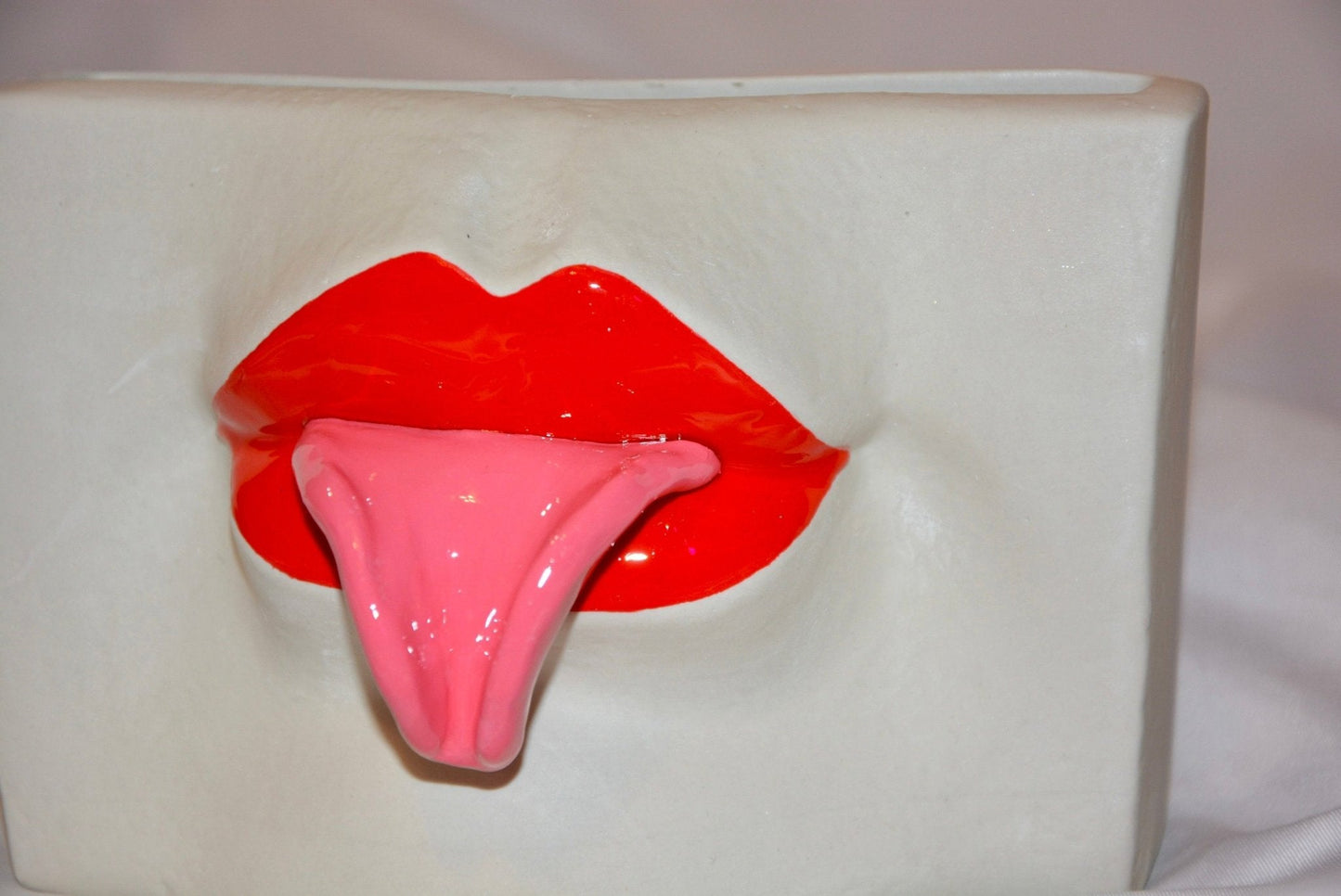 CERAMIC TONGUE-OUT VASE