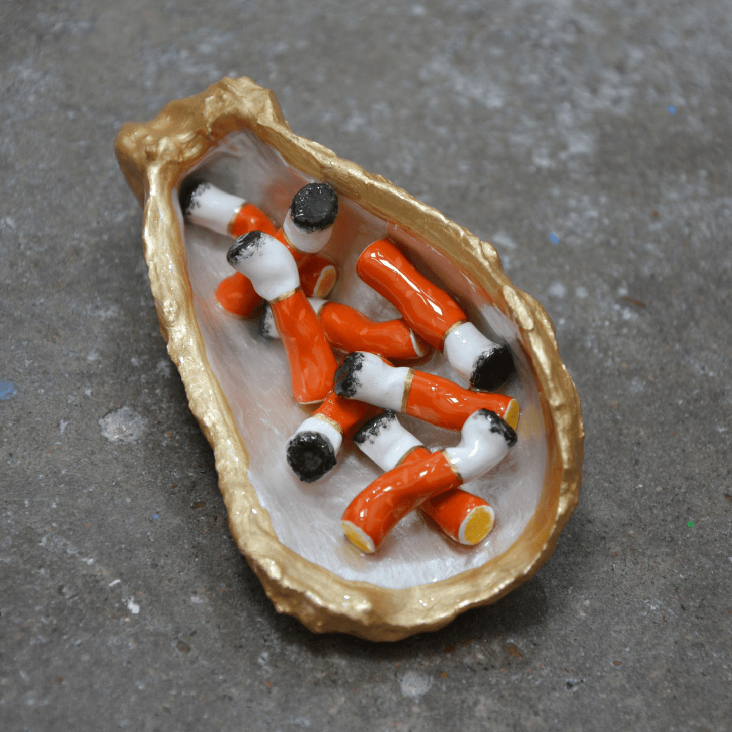 OYSTER SHELL CIGARETTE SCULPTURE